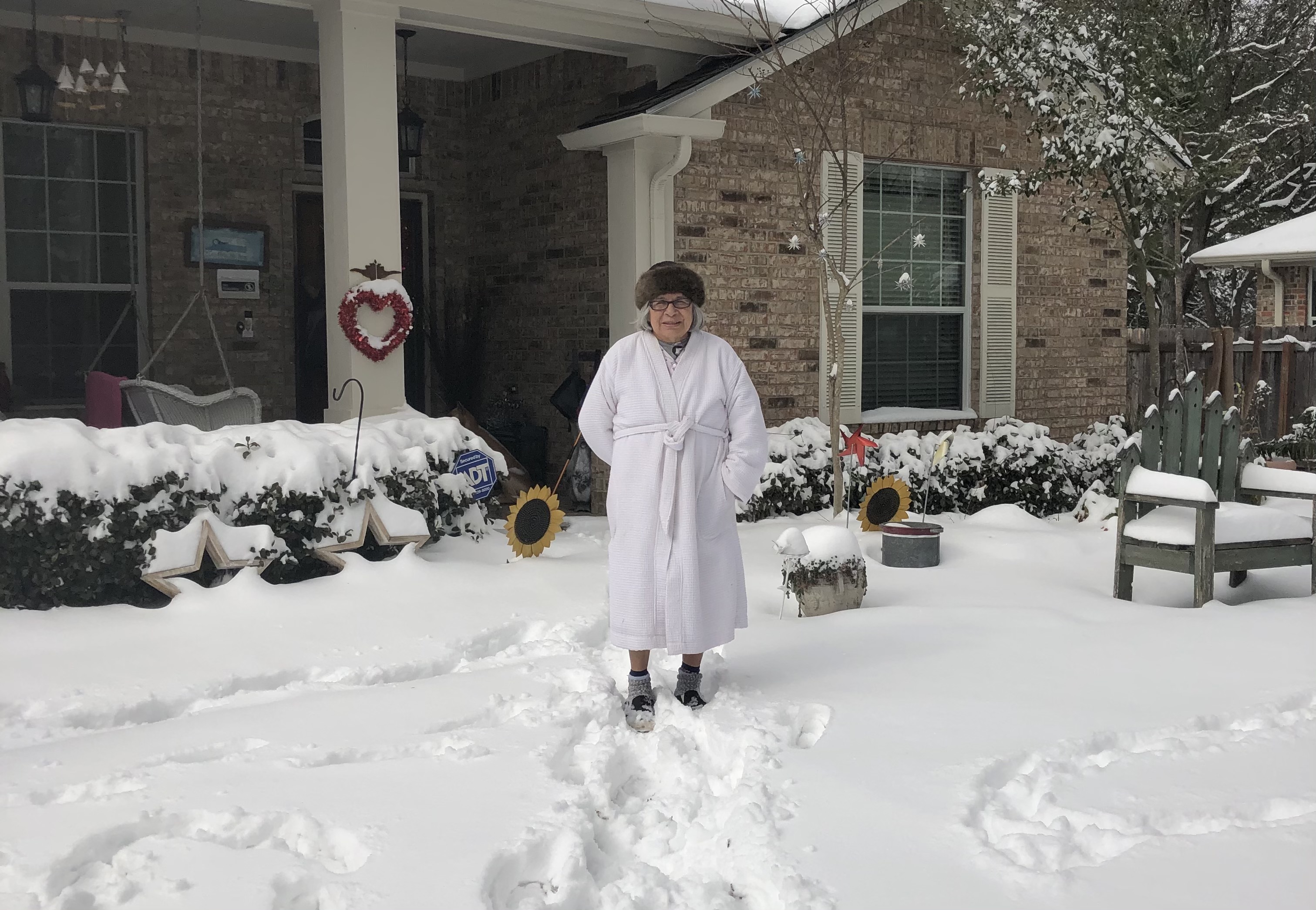 Grandma walking in the snow.